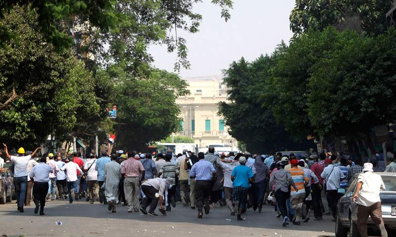 Supporters of ousted President Mohamed Mursi run during the assault.