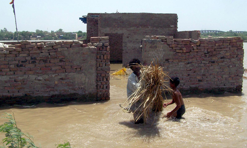 Flood affected people trying to salvage their belongings in the flood hit area at Sehreshi Nager Qasmabad Kotri Bridge. – Photo by INP