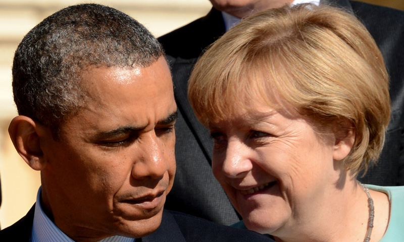US President Barack Obama (Left) stands next to Germany’s Chancellor Angela Merkel for pictures. –Photo by AFP