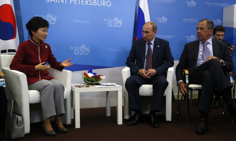 Russia’s President Vladimir Putin (Center) and Russian Foreign Minister Sergei Lavrov listen to South Korea's President Park Geun-Hye (Left) during a bilateral meeting. –Photo by AFP