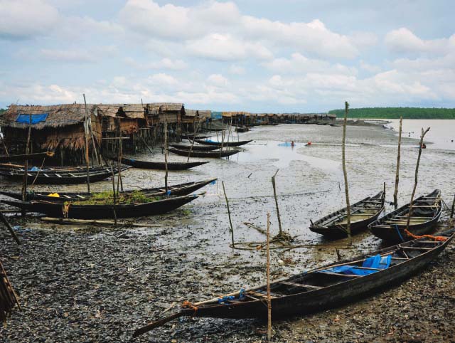 In Kolabogui, a settlement of 1,000 families over the wreaked dam called Jhulanto Para (Hanging Village), makes a living on houses made up on top of bamboos. — Photo Ananta Yusuf