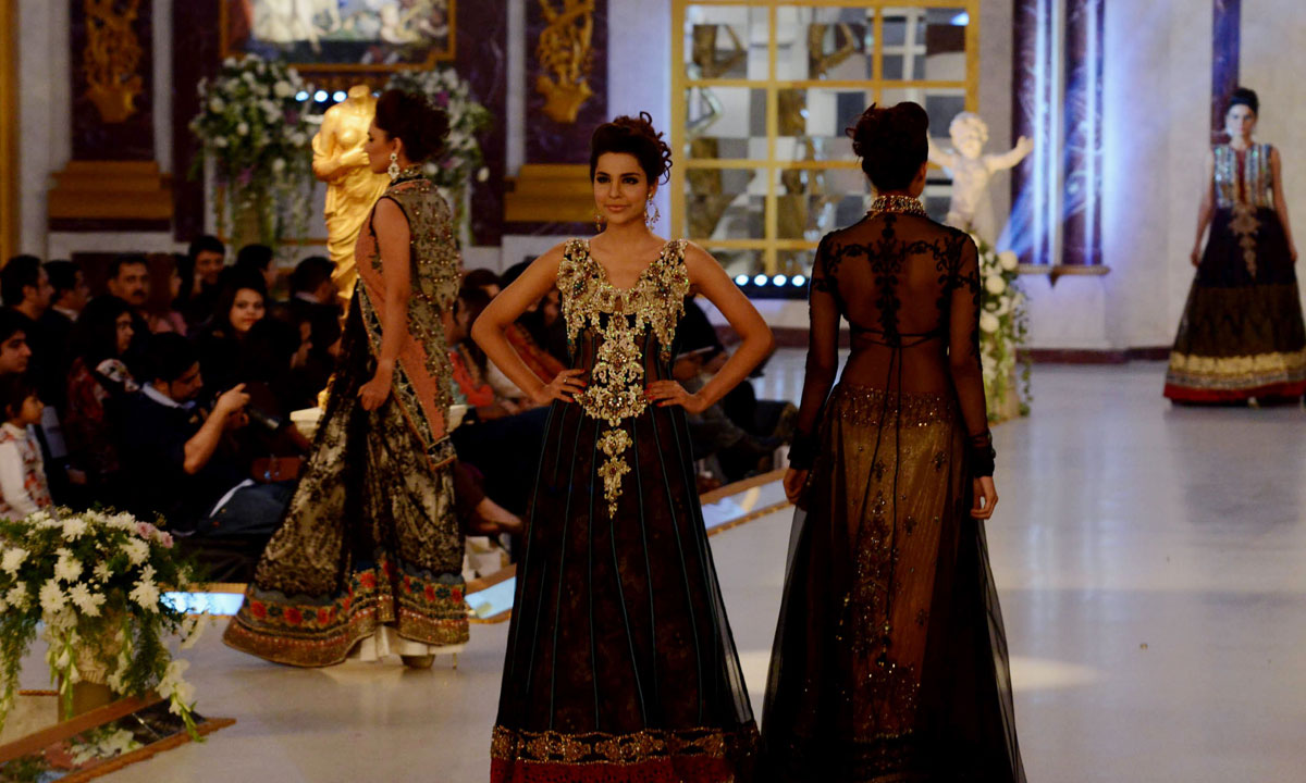 Pakistani models present creations by designer Ammar Shahid. – Photo by AFP