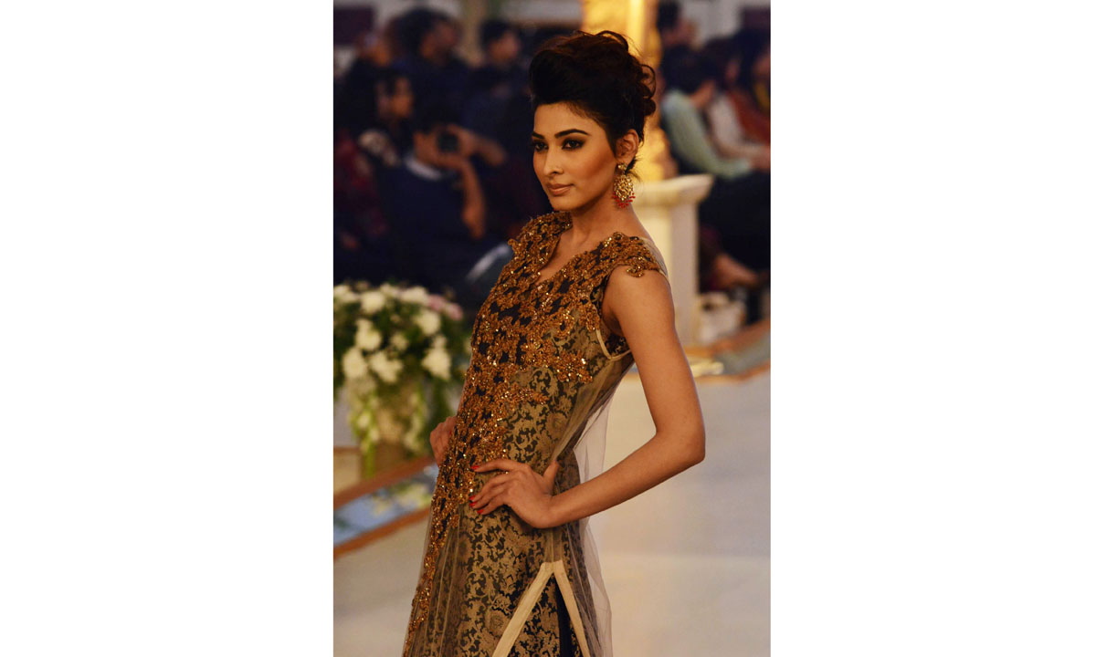 A Pakistani model presents a creation by designer Ammar Shahid. – Photo by AFP