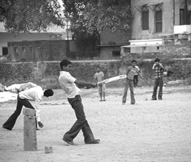   Boys playing cricket on an empty plot in Lahore in 1973.