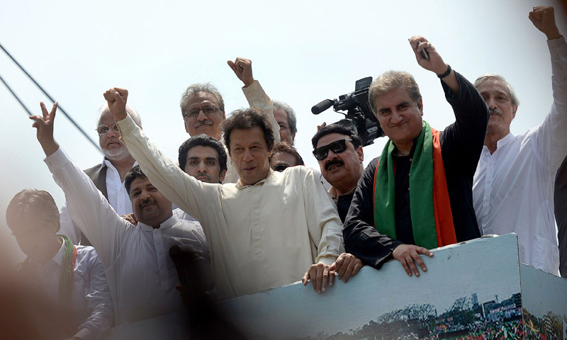 — AFP Photo shows Imran Khan waving as he heads a protest march from Lahore