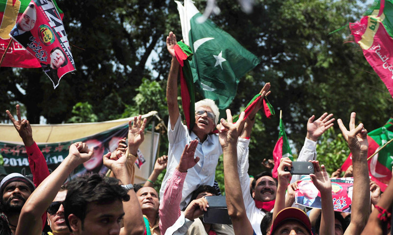 — AFP Photo shows supporters cheering for Imran Khan as he heads a protest march from Lahore to Islamabad against the government