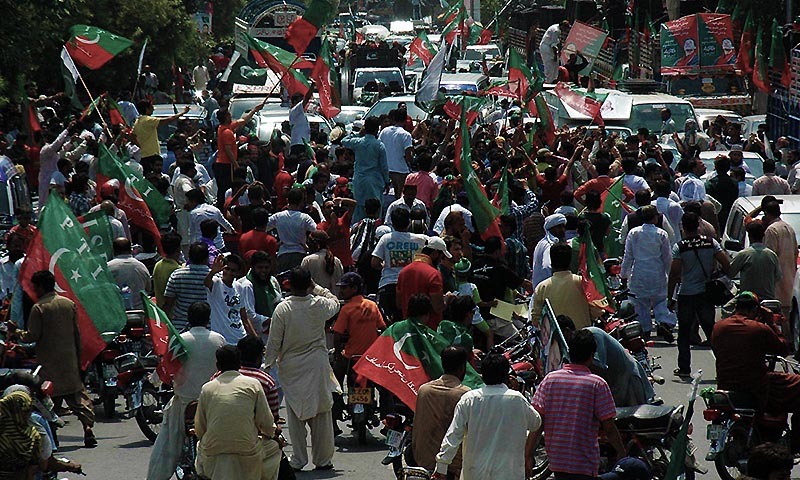 Activists of Pakistan Tahreek-i-Insaf taking part in Azadi March in Lahore. — Photo by Online