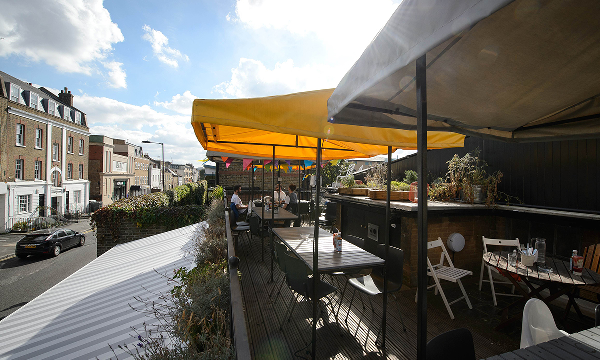 A picture shows part of the exterior of the "The Convenience", a former public toilet that has been converted into a coffee shop and restaurant in Hackney, east London. — Photo by AFP