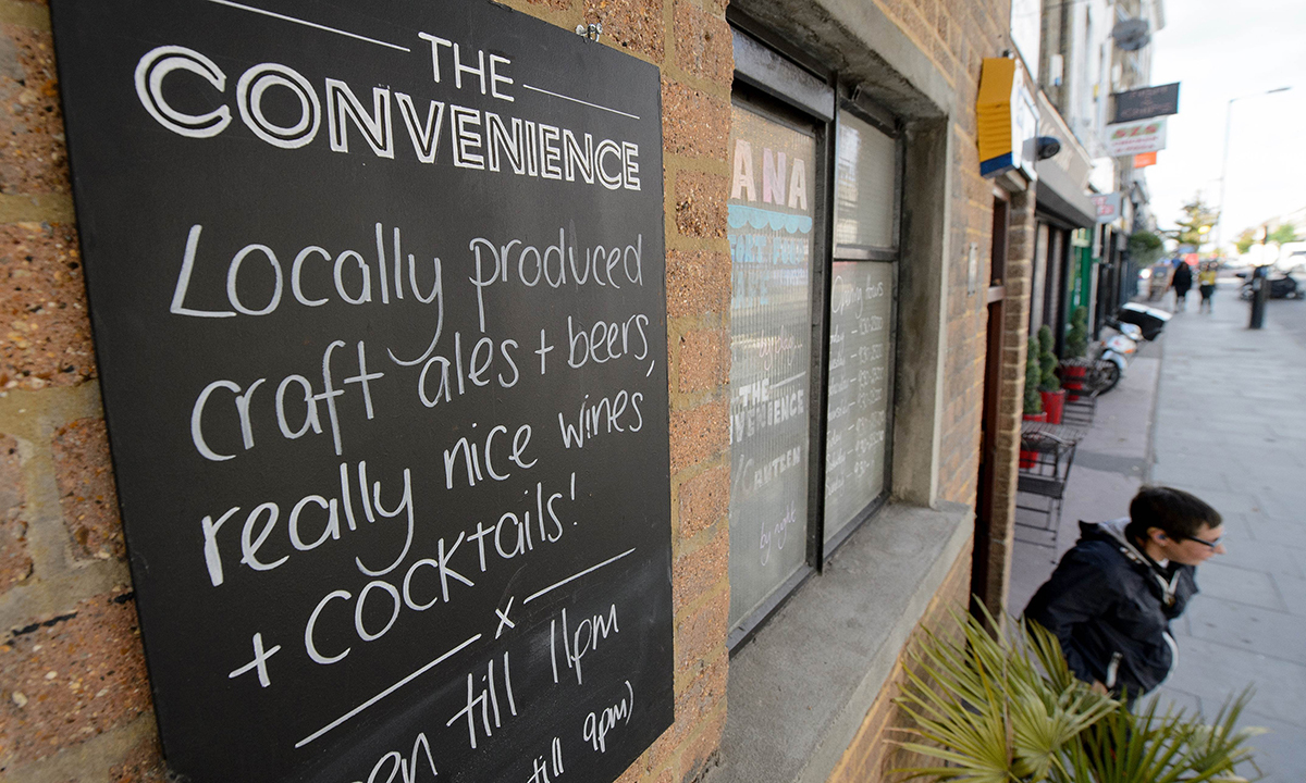 A picture shows part of the exterior of the "The Convenience", a former public toilet that has been converted into a coffee shop and restaurant in Hackney, east London. — Photo by AFP