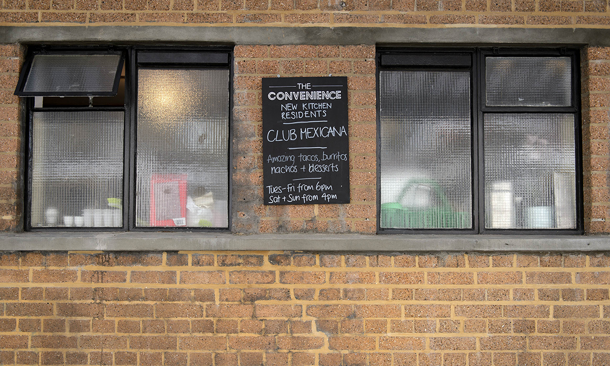 A picture shows part of the exterior of the "The Convenience", a former public toilet that has been converted into a coffee shop and restaurant in Hackney, east London. — Photo by AFP