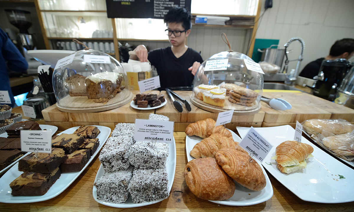 Pastries and cakes are displayed in "Attendant", a former public toilet that has been converted into a coffee shop and sandwich bar in central London. — Photo by AFP