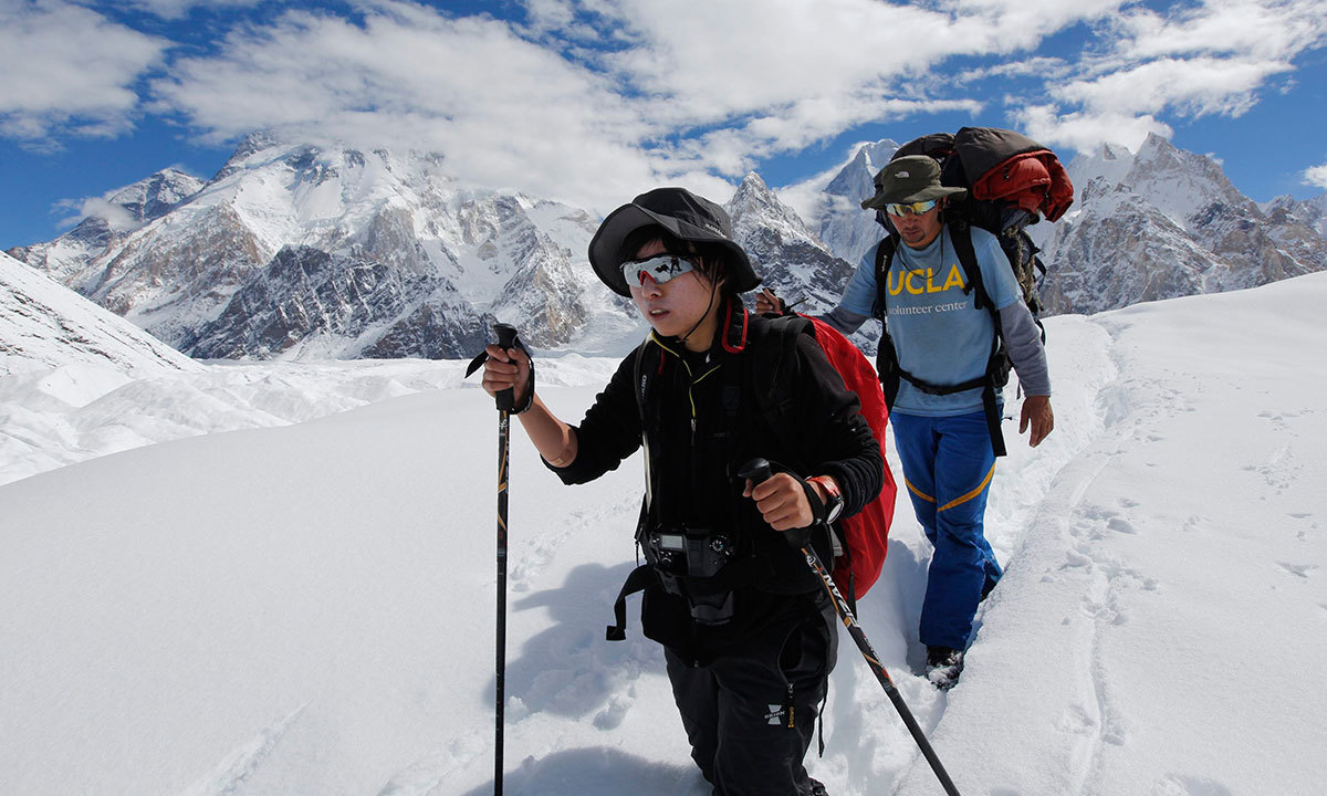 A porter guides his trekking client down the Baltoro glacier in the Karakoram mountain range in Pakistan. -Reuters Photo