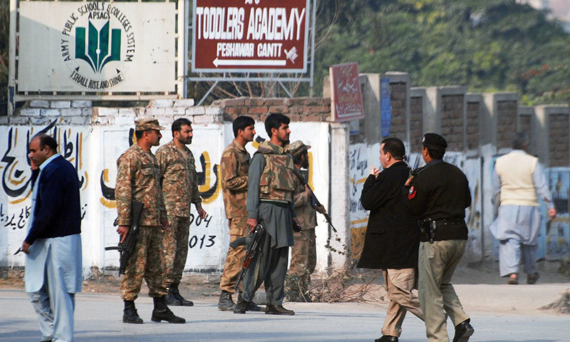 Security forces takes up positions on a road leading to the Army Public School — Reuters