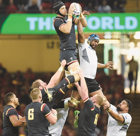 CARDIFF: Luke Charteris of Wales wins a lineout during the World Cup match against Fiji at the Millennium Stadium.—Reuters
