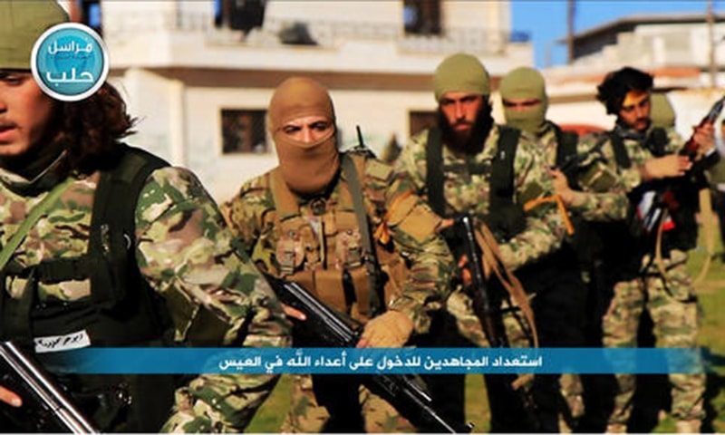 Nusra Front fighters marching toward the northern village of al-Ais in Aleppo province, Syria. -AP