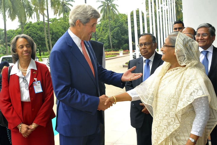 US Secretary of State John Kerry and Bangladesh Prime Minister Sheikh Hasina shake hands ahead of a meeting in Dhaka on Monday.—AFP