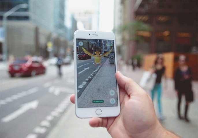 A ‘Pidgey’ Pokemon is seen on the screen of the Pokemon Go mobile app in a photo illustration taken in downtown Toronto on July 11.—Reuters