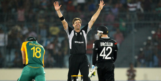Jacob Oram took four wickets and two terrific catches to turn around the third quarter-final. —Photo by Reuters