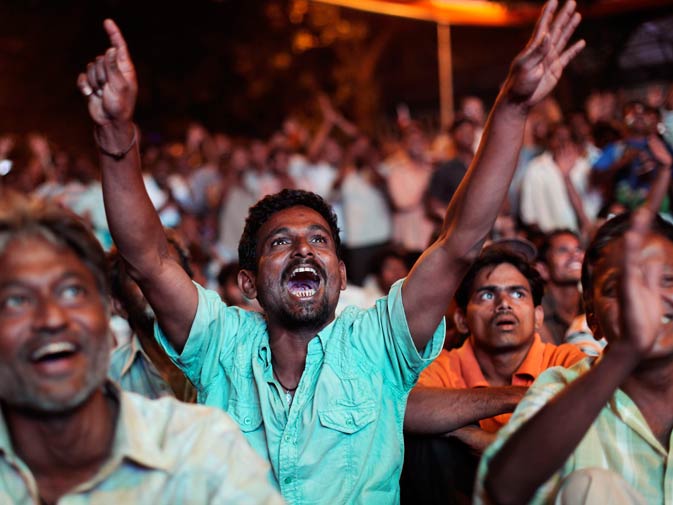 Indian fans cheer for their team. ? Photo by AP