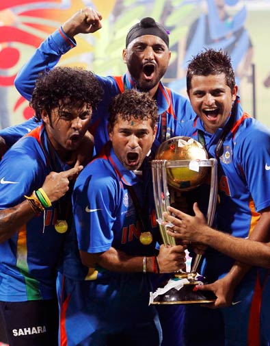 Shanthakumaran Sreesanth, Sachin Tendulkar, Harbhajan Singh (top) and Suresh Raina (L-R) celebrate with their trophy. ? Photo by Reuters