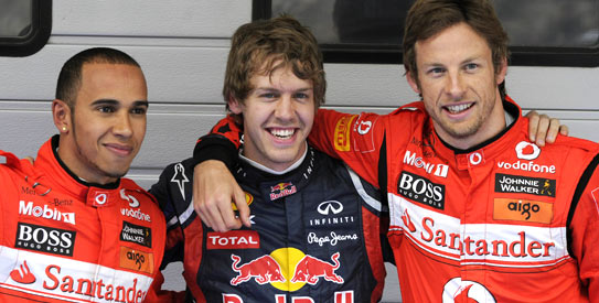 Vettel (C) finished ahead ot the two McLaren drivers, Button (R) and Hamilton (L). —Photo by AFP