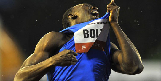 “He’s happy where he is at the moment,” says the world's fastest man's coach. —File photo