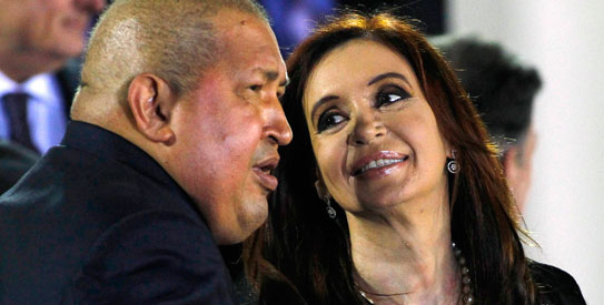 Argentina's Cristina Fernandez de Kirchner (R) chats with her Venezuelan counterpart Hugo Chavez during the family photo session of the 33-member Community of Latin American and Caribbean States (CELAC) summit in Caracas. —Reuters Photo