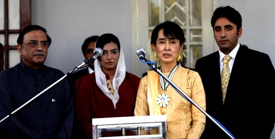 Myanmar's pro-democracy leader Suu Kyi talks to reporters after receiving the Benazir Bhutto Shaheed Award for Democracy in Yangon