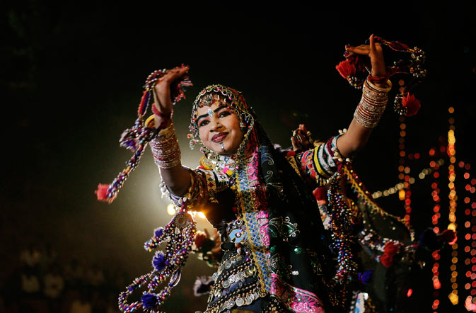 Indian dancer from Rajasthan state wearing traditional attire performs during the Basant Utsav or Spring Festival celebrations at Gandhinagar, about 35 kilometers (22 miles) from Ahmedabad, India. The ten-day long festival, began Thursday, features culture and crafts of various Indian states. ? AP Photo.