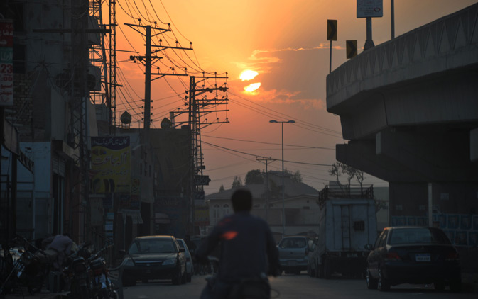 A commuter rides his motorbike during sunset in Multan in Punjab province on March 12, 2012.  Pakistan invited Islamist militant groups including the Taliban for peace talks and said banned organisations would be delisted if they "closed down their militant wings", a news report said. Islamist militants have killed more than 4,900 people across Pakistan since government troops raided an extremist mosque in Islamabad in July 2007. The military says more than 3,000 soldiers have died, and there were about 120 bomb at