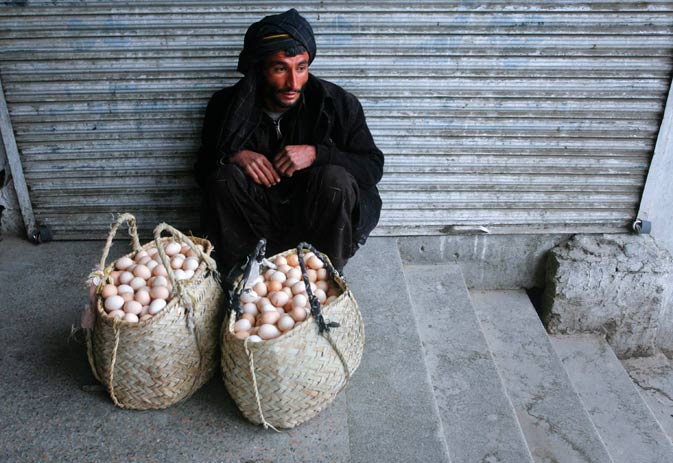A man awaits customers while selling eggs on a sidewalk in Quetta March 12, 2012.  ?
Reuters Photo