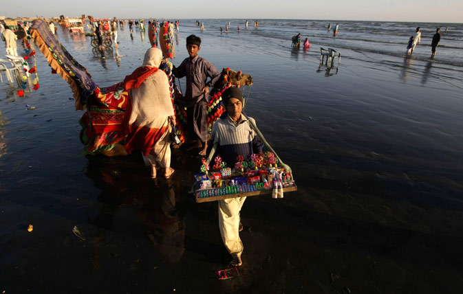 A Pakistani vendor sells toys at a beach in Karachi, Pakistan, Friday, March 9, 2012. ?
AP Photo