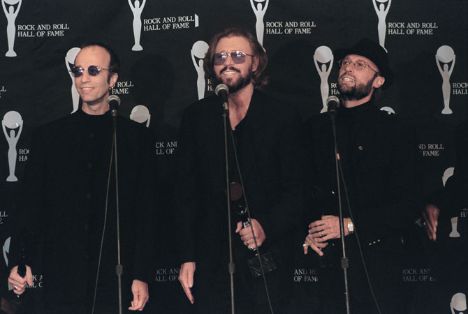 The Bee Gee's consisting of brothers (From left) Robin, Barry and Maurice Gibb appearing backstage after they were inducted into the Rock and Roll Hall of Fame. – File photo AFP 