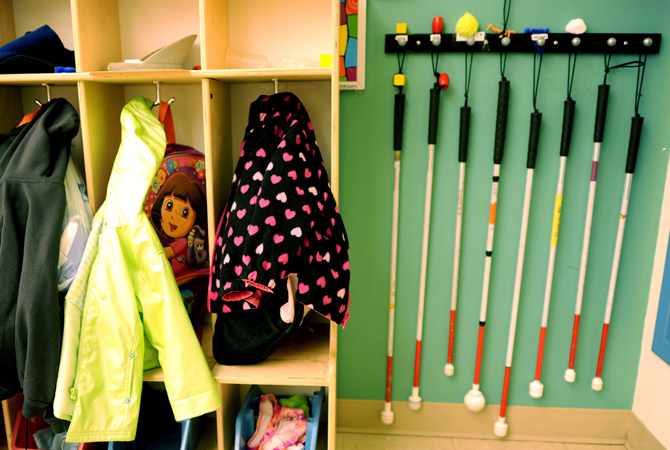 Walking canes hang next to the coat rack at the Concordia Learning Center at St. Joseph's School for the Blind in Jersey City, New.