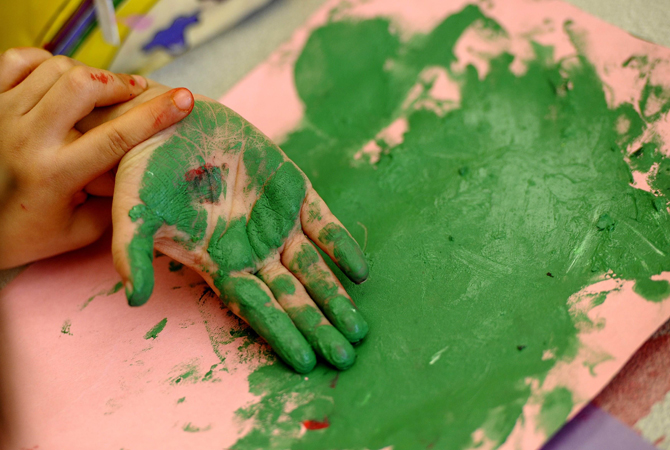 Children paint their hands in art class at the Concordia Learning Center at St. Joseph's School for the Blind in Jersey City, New Jersey.