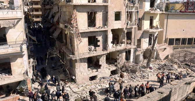 People gather at the site of an explosion of a bomb car.—Reuters Photo