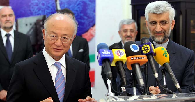 International Atomic Energy Agency (IAEA) chief Yukiya Amano (L) speaks during a press conference as Iran's chief nuclear negotiator Said Jalili (R) looks on in Tehran on May 21, 2012 during the former's official visit that was being closely watched ahead of wider nuclear talks between Iran and world powers later this week. AFP PHOTO/FARS NEWS/HAMED JAFARNEJAD