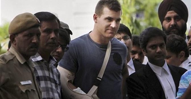 Australian cricketer Luke Pomersbach, center, comes out of a court after being granted bail in New Delhi, India, Saturday, May 19, 2012. Indian authorities have released Pomersbach on bail on Saturday, a day after the Royal Challengers Bangalore cricket player was arrested for allegedly molesting a woman and assaulting her fiance. (AP Photo)