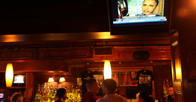 obama-on-gay-marriages670 Patrons at the Stonewall Inn, a historic gay bar in Greenwich Village, watch a news report that shows President Barack Obama saying that same sex couples should be able to get married.—AFP Photo