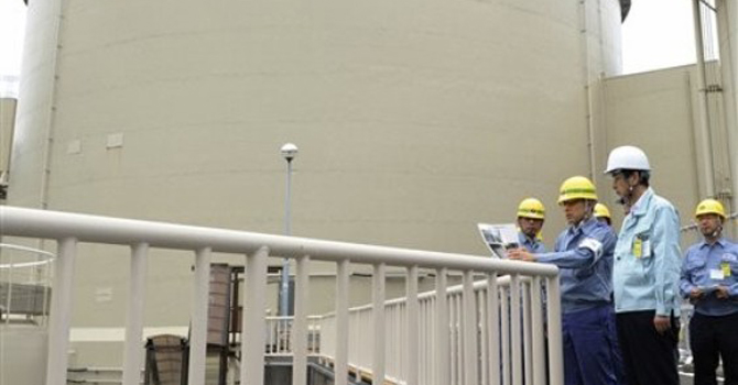 In this photo taken Tuesday, June 12, 2012, Fukui Gov. Issei Nishikawa, foreground, inspects Kansai Electric Power Co's Ohi nuclear power plant in Ohi, Fukui prefecture, western Japan. – AP