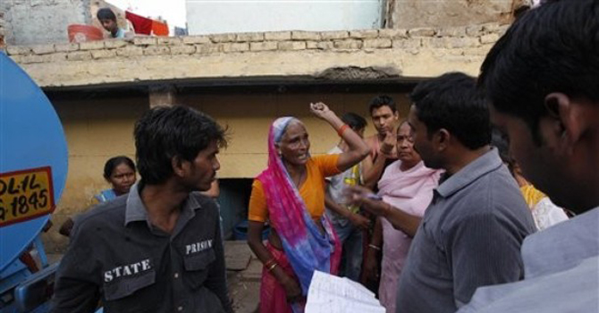 An Indian woman complains of the shortage of water to an official in New Delhi, India. – AP 