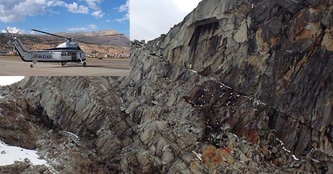 On a rocky mountain lays what officials say is debris from the wreckage of a helicopter in the department of Cuzco, Peru, Saturday, June 9, 2012. Rescue specialists on Saturday located the wreckage of a helicopter that went down on Mama Rosa mountain in a snowy part of the southeastern Andes with 14 people aboard, including eight South Koreans and three Europeans, Peru's police chief said.  (AP Photo)