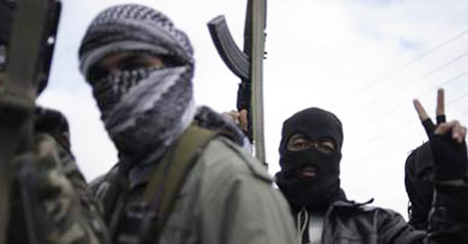 Members of the Free Syrian Army patrol an area in Qusayr. - Photo by AFP