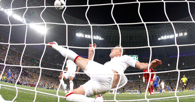 terry-england-ukraine-ap_670 Marko Devic forced a save from Joe Hart in the 62nd minute and John Terry cleared off the line. Television replays suggested that the ball had crossed the line for a goal but Hungarian referee Viktor Kassai waved play on. — Photo by AP
