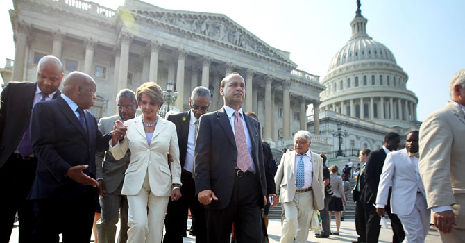 WASHINGTON, DC - JUNE 28: U.S. House Democratic members, including (L-R) Rep. Andre Carson (D-IN), Rep. John Lewis (D-GA), Rep. George Meeks (D-NY), House Minority Leader Rep. Nancy Pelosi (D-CA), Rep. Bobby Rush (D-IL), and Rep. Luis Gutierrez (D-IL), participate in a walkout in protest of a vote on whether Attorney General Eric Holder was in contempt of Congress June 28, 2012 on Capitol Hill in Washington, DC. The House was scheduled for the contempt vote after Holder was accused for not submitting some of the documents in the Fast and Furious program, a federal law enforcement operation that allowed guns to circulate across the border between the U.S. and Mexico, to a House panel investigating it. 