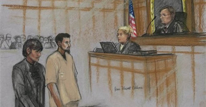 In this courtroom sketch, Rezwan Ferdaus, second left, and his attorney Catherine Byrne, left, stand during Ferdaus' arraignment hearing in federal court in Worcester, Mass. Monday afternoon, Oct. 3, 2011. Ferdaus pleaded not guilty to plotting to fly explosives-packed remote-controlled model planes into the Pentagon and U.S. Capitol. (AP