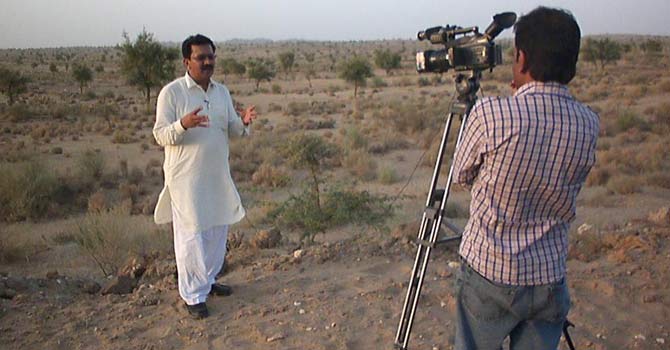 Faiz Khoso shoots an episode with his cameraman. – Photo courtesy KTN