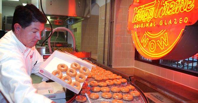 Krispy Kreme doughnuts go into production. — Reuters Photo