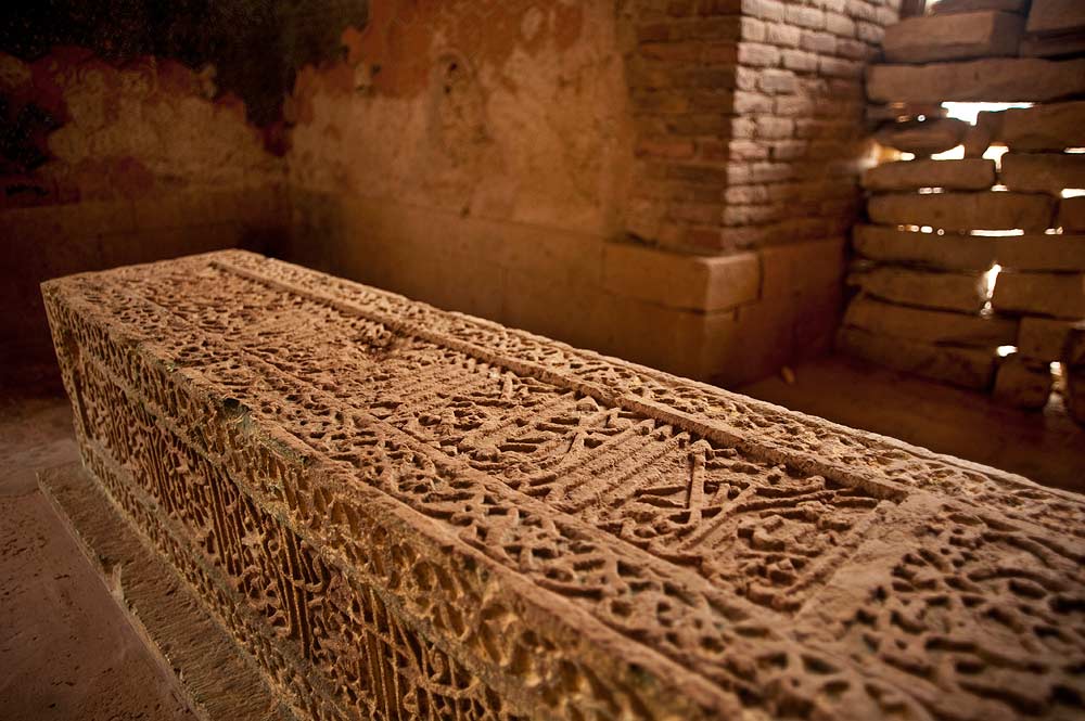 Inside the tomb, the grave is decorated with complex Quranic calligraphy. In Makli, Arabic scripts like Naskh and Nastaleeq were inscribed on stone graves in an expression of faith. - Photo by Nadir Siddiqi/Dawn.com