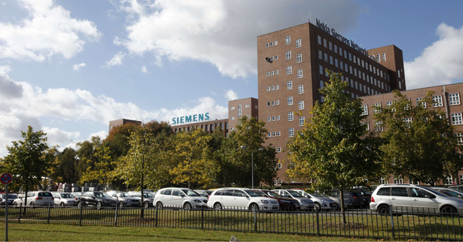 The logo of Siemens AG company and the telecommunications services company Nokia Siemens Networks is pictured on top of their offices in Berlin